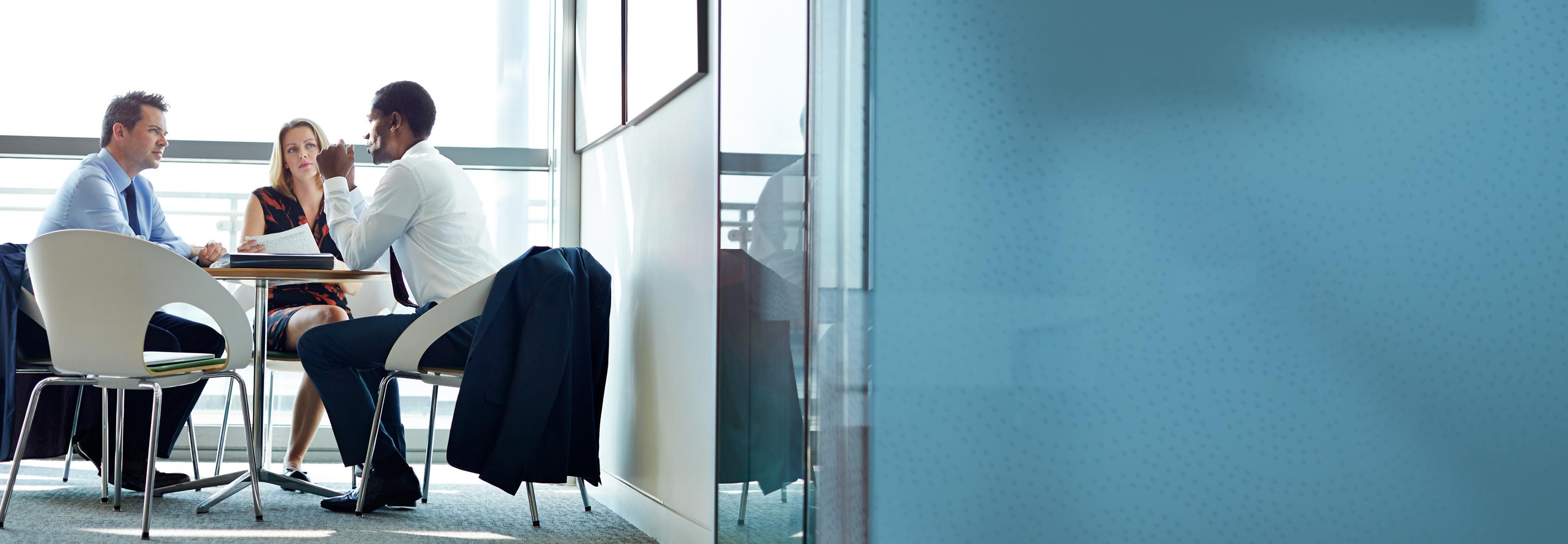 Business people talking in meeting at conference table